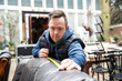 © Connect Images - Worker with Down syndrome measuring sofa