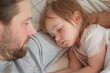 © Marina Demidiuk - Father and his little daughter toddler girl sleeping together. Healthy sleep. Happy Loving family parent and child sleeping white bed at home. Authentic lifestyle fatherhood moments. Single dad life