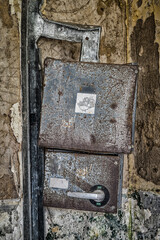 Two electrical switchboxes in an abandoned building