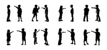 Silhouette Of Two Children Quarreling, Debating, Pointing At Each Other, Shouting, Angry