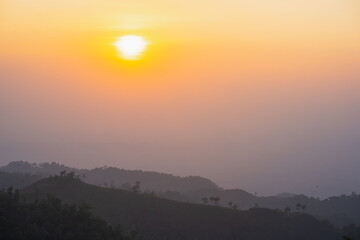Canvas Print - silhouette and panorama layer of mountain with sunset background