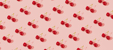 Fresh Juicy Cherries, Creative Fruit Pattern, Dusty Rose Pink Background. 