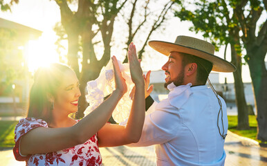 portrait young adult latin american couple dancing cueca national dance in huaso dress in the city square