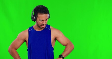 Poster - Exhausted, music with a man runner on a green screen background checking his time and bpm heart rate. Fitness, sweat and breathing with a young male athlete looking at his watch on chromakey mockup