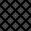 © t2k4 - Geometric pattern in ethnic style. Seamless background  with  abstract shapes. Black and white wallpaper. Abstract background  with Repeating pattern for decor, textile and fabric.