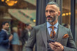 © ADDICTIVE STOCK - Generative AI illustration of bearded adult businessman with mobile phone in elegant suit looking away while standing near glass wall