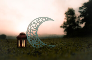 Wall Mural - Eid Mubarak concept photography, Ramadan Kareem greetings image, Crescent moon shape with red lantern lamp in the park