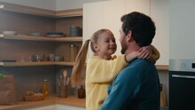 Caucasian Lovely Father Dad Nose Kiss Touching Noses Swirling Rotate Little Beloved Cute Adorable Child Girl Daughter Kid Happy Family Hugging Love Parenting Fatherhood Relationship At Home Kitchen