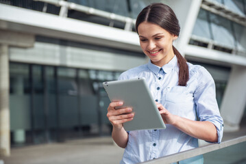 Wall Mural - Beautiful business lady with gadget