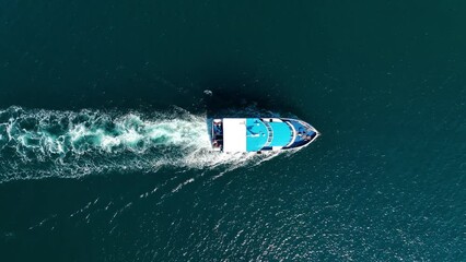 Wall Mural - Vacation and leisure. Aerial view on fast boat on blue Mediterranean sea at sunny day. Fast ship on the sea surface. Seascape from the drone. Seascape from air. Seascape with motorboat.