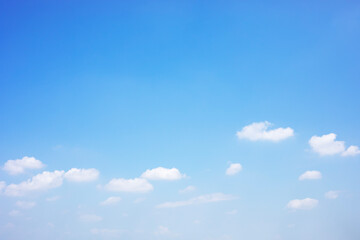 Wall Mural - blue sky background and white clouds soft focus, and copy space horizontal shape.