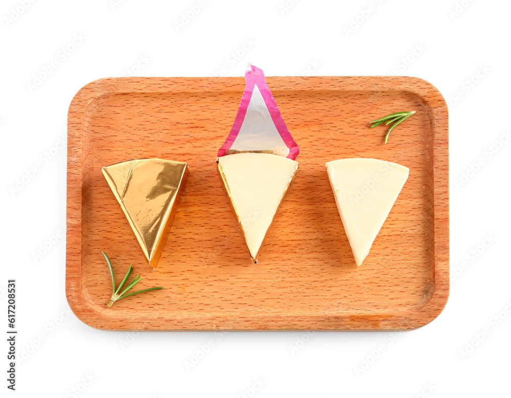 Wooden board with triangles of tasty processed cheese on white background