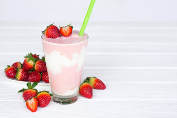 Wall Mural - Strawberry yogurt fruit juice smoothie pink colorful fruit juice milkshake blend beverage healthy high protein the taste yummy In glass drink episode morning on white wood background.