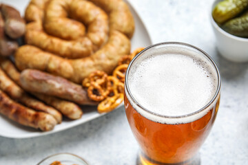 Glass of cold beer on light background. Oktoberfest celebration