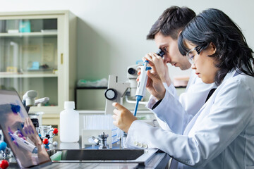 Poster - Multinational researcher group experimenting in the lab.