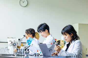 Poster - Multinational researcher group experimenting in the lab.