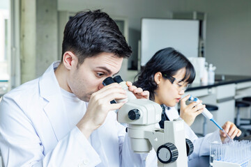 Poster - Multinational researcher group experimenting in the lab. Research and Development.