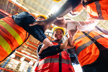 Wall Mural - Group of diverse industrial worker work together in manufacturing plant. 