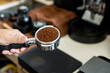 © pariwatpannium - Barista making coffee in the coffee shop. Selective focus.