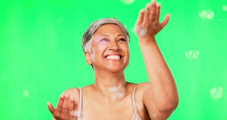 Poster - Old woman, bubbles and natural beauty, green screen with fun and playful, cosmetic care and skin on studio background. Happy female model, antiaging and freedom with glow, skincare and dermatology