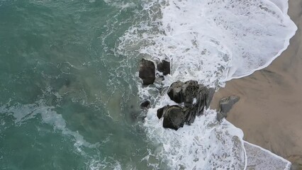 Wall Mural - Aerial view of ocean and coastal beach