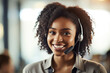 Customer service smiling African - American woman working at a phone call center