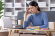 © David - Young asian woman ecommerce SME business stressed leaning on package at home office, stressed headache Startup small business entrepreneur asian woman work package post shipping box delivery parcel
