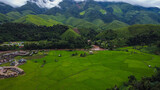 Fototapeta Pokój dzieciecy - Beautiful aerial view of the green rice field and green mountain, Nan, Thailand.