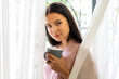 © Art_Photo - Portrait of smiling happy enjoy beauty woman relax drinking cup of hot coffee or tea,Cappuccino,Espresso,Americano,Latte.Girl felling enjoy breakfast in holiday morning vacation on bed at home