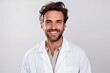 © igolaizola - Portrait of a smiling doctor in white coat standing isolated over white background