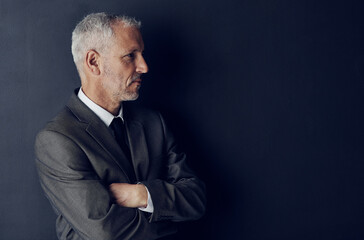 Aufkleber - Senior executive, business man and arms crossed, confidence and management on dark background. Male CEO, corporate director in suit and ambition, mockup space with empowerment and career in studio