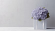 © Friedbert - A white vase with purple flowers in it. Generative AI. Panoramic banner with hydrangea flowers, copy space.