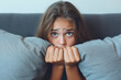 © Rafa Fernandez - Scared teen woman at home embracing pillow . AI Generative