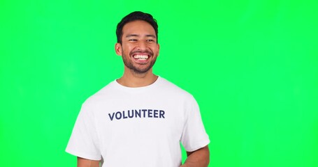 Sticker - Face, funny volunteer and man on green screen in studio isolated on a background mockup space. Portrait, happy and Asian person for charity laughing at comedy, joke or humor for community service.