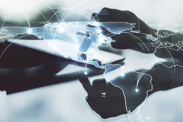 Poster - double exposure of abstract digital world map with connections and hand working with a digital table