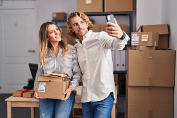 Sticker - Man and woman ecommerce business workers make selfie by the smartphone at office