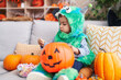 © Krakenimages.com - Adorable hispanic boy having halloween party holding sweets at home