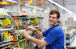 © industrieblick - young operator assembles machine in a modern high tech factory - production of switch cabinets for industrial plant
