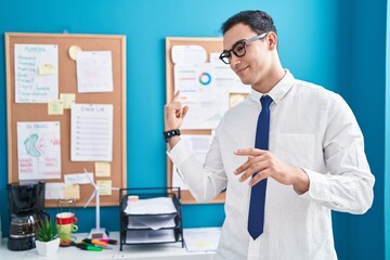 Sticker - Young hispanic man business worker smiling confident speaking at office