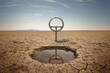 © ADDICTIVE STOCK - Generative AI image of metal pole near pond surrounded with dry crack landscape against blue sky