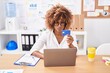 © Krakenimages.com - African american woman business worker using laptop and credit card at office