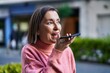 © Krakenimages.com - Middle age woman smiling confident talking on the smartphone at street