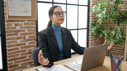 Poster - Young beautiful hispanic woman business worker doing yoga exercise at office