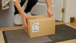© Krakenimages.com - Middle age woman holding package at home