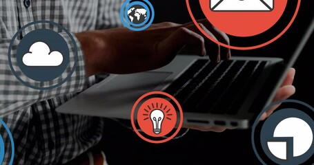 Poster - Animation of icon in circles over midsection of caucasian man using laptop