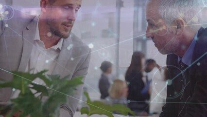 Poster - Animation of network of connections against two diverse businessmen discussing at office