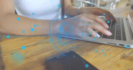 Poster - Animation of dots around padlock in shield, midsection of biracial woman using laptop