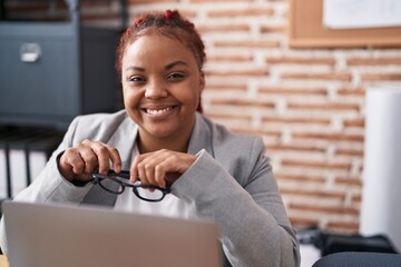 Sticker - African american woman business worker using laptop holding glasses at office