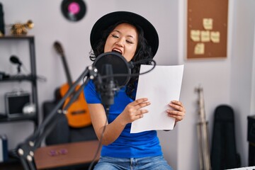 Sticker - Young chinese woman artist singing song at music studio