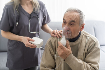 Elderly Senior Man nursing care wear oxygen inhaler device for helping breath respiratory. Oxygen Concentrator portable